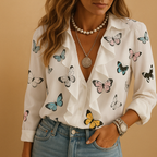 Women’s blouse with ruffles and butterfly print, lightly tailored fit, and long sleeves. Perfect for work, casual days, and formal occasions.