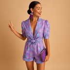 Short summer jumpsuit for women with vibrant print and belted waist, perfect for warm days, evening outings, and stylish summer occasions.