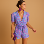 Short summer jumpsuit for women with vibrant print and belted waist, perfect for warm days, evening outings, and stylish summer occasions.