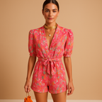 Short summer jumpsuit for women with vibrant print and belted waist, perfect for warm days, evening outings, and stylish summer occasions.