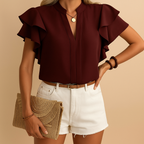 Women’s sleeveless elegant blouse with tailored fit and light fabric, perfect for office wear, evenings out, or casual chic looks.